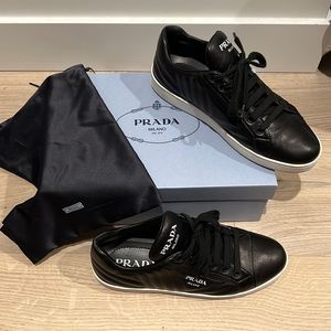 These are the quilted black leather PRADA sneakers.Size EU 8.5.PERFECT CONDITION